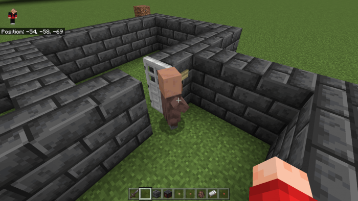 The Villager presses button to open the door
