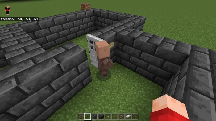 The Villager presses button to open the door