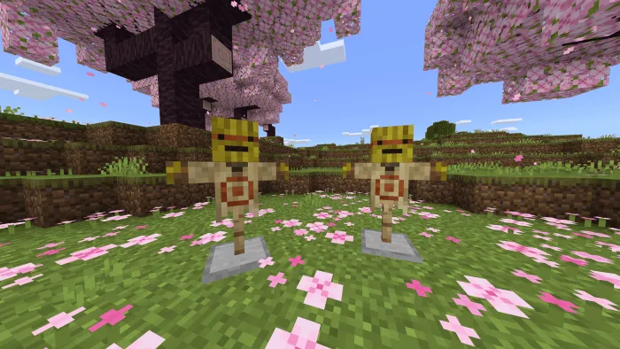 Two target dummies in a floral field.