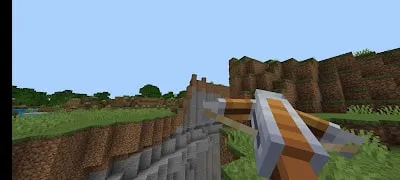 Player aiming crossbow at grassy cliffs