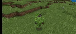 Blocky green dinosaur standing on grass