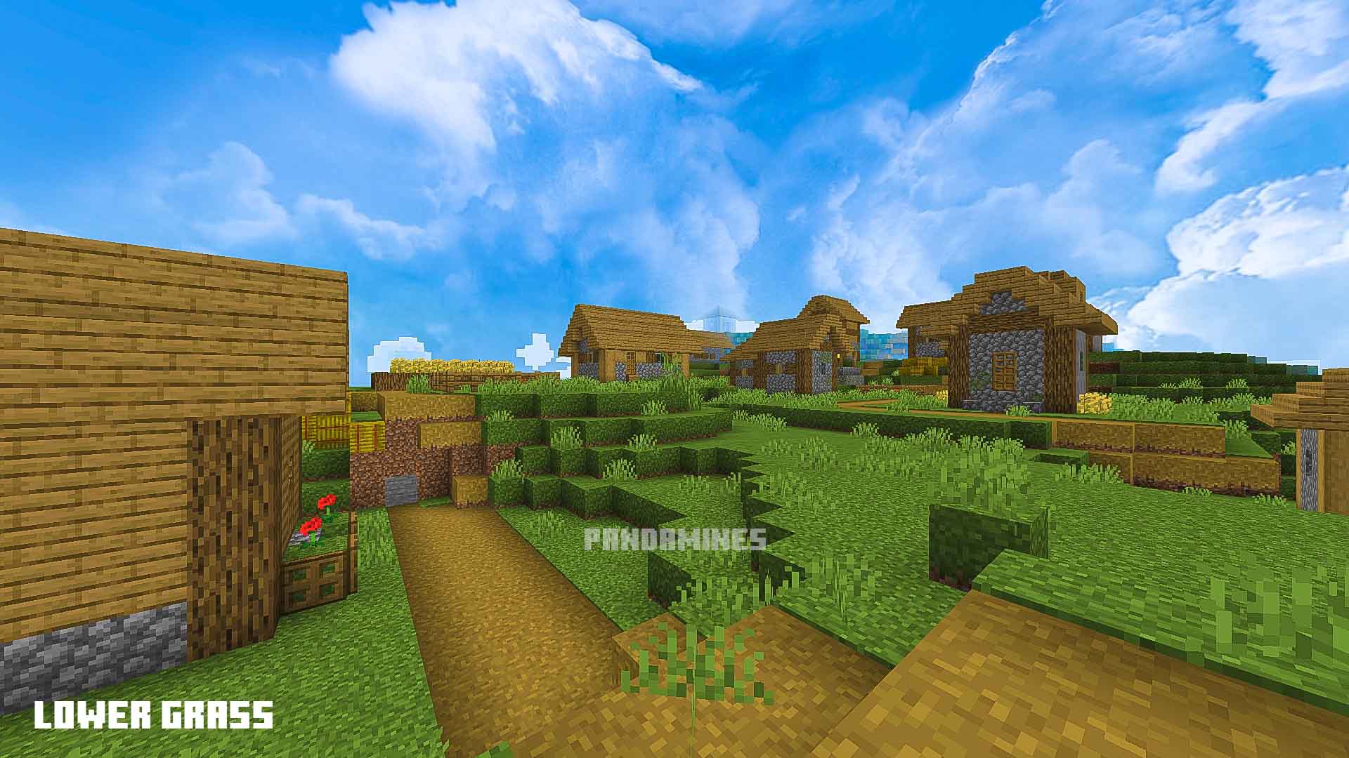 Pixelated village with lush green grass.