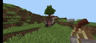 Two dinosaurs on grassy hillside in-game