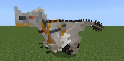 Blocky dinosaur with saddle on grassy field