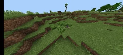 Grassy hills with a dinosaur nest in-game