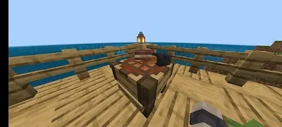 Wooden table with lamp on ocean deck