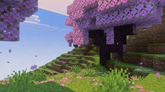 Blossoming trees on grassy hillside.
