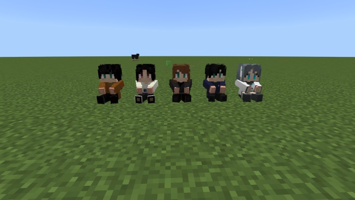 Five pixelated dolls on grass.
