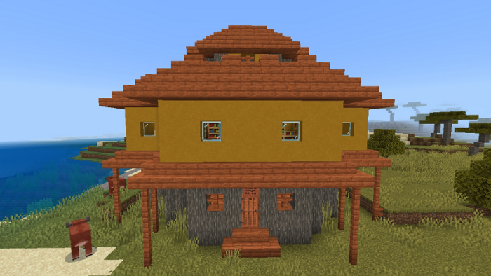 Enchanted yellow house near the shore.