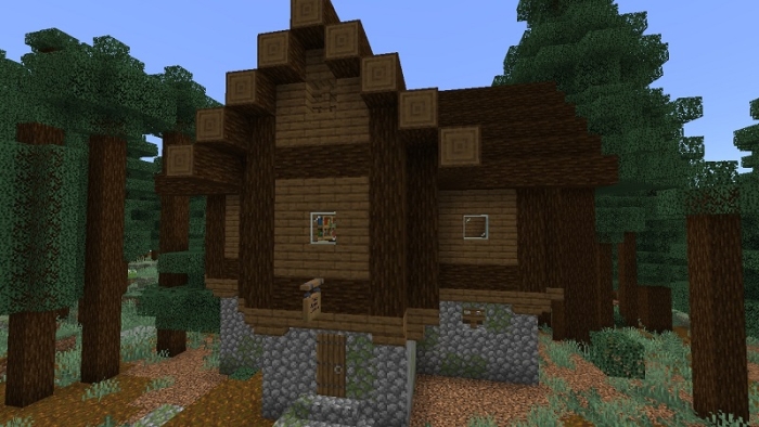 Wooden house in a forest setting.