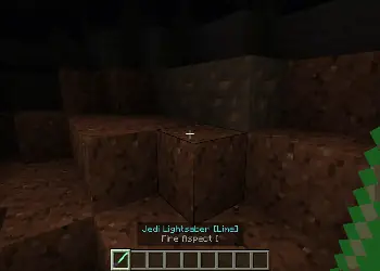 Green lightsaber in a dark cave.