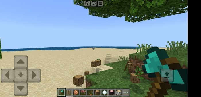 Player holding axe near chopped tree.