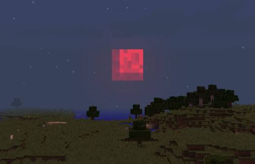 Blocky red moon over pixelated landscape.