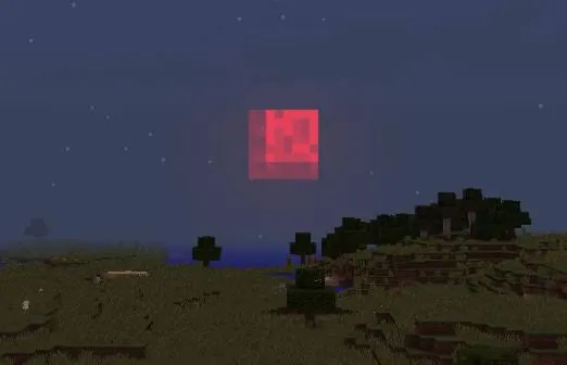 Blocky red moon over pixelated landscape.