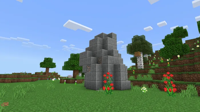 Stone structure with flowers in a field.