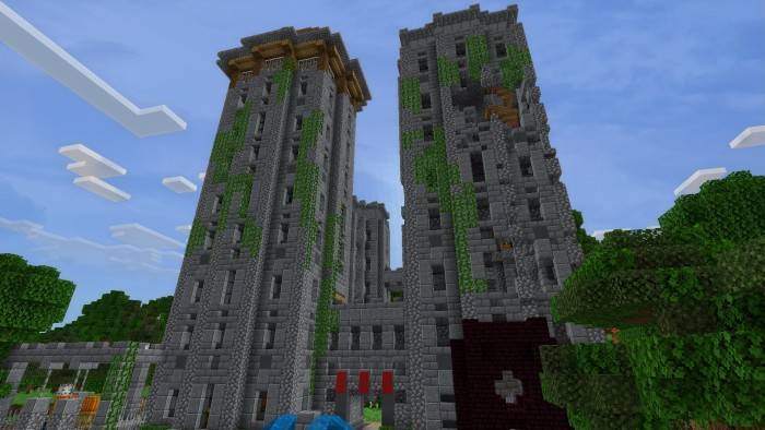 Towering stone structures with vines.