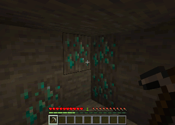 Character mining glowing ore blocks.