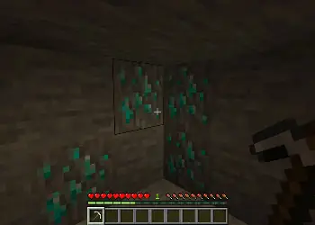 Character mining glowing ore blocks.