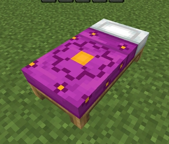 Purple bed with geometric design.