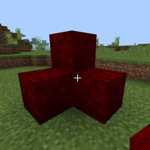 Red mutated blocks in grassy terrain.