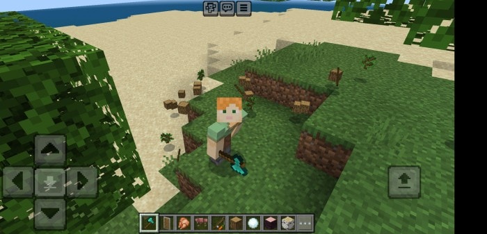 Character holding axe on grassy hill.