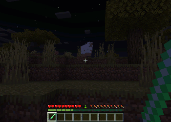 Player holding a lightsaber at night.