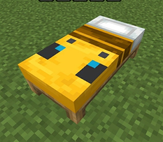 Yellow bed with bee-themed design.