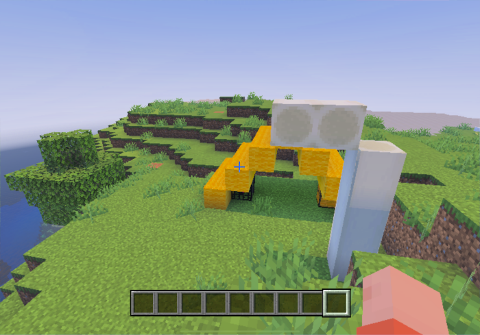 Yellow structures on grassy terrain