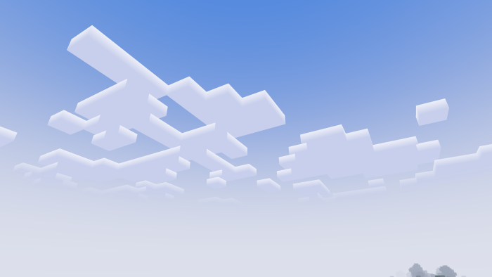 Blocky clouds in a clear blue sky.
