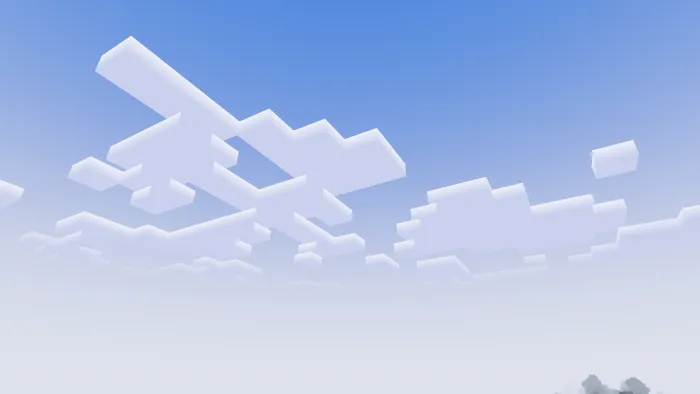 Blocky clouds in a clear blue sky.