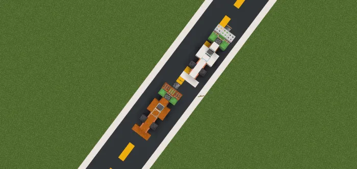 Two F1 cars on a racetrack.