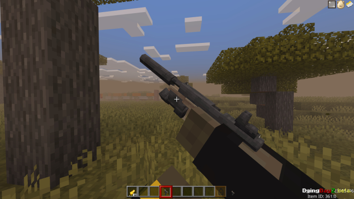 Player holding a gun in a blocky landscape.