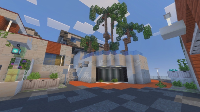 Blocky modern building with palm trees.