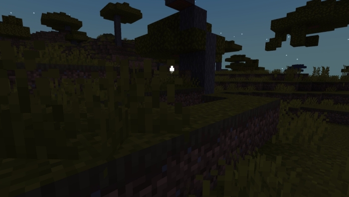 Dark landscape with glowing entity.