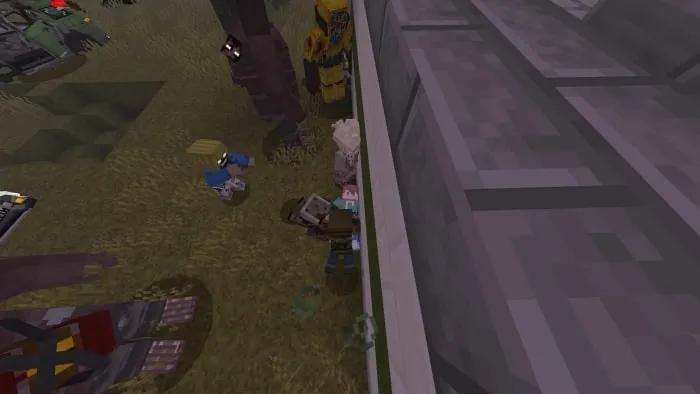 Pixelated characters near a building wall.