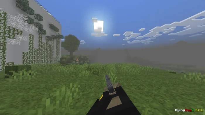 Gun aiming in a grassy landscape.