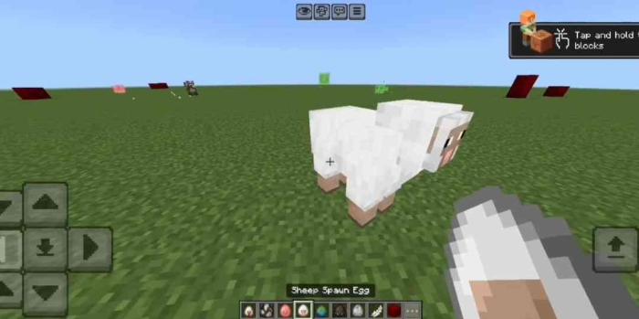 Sheep spawn egg in grassy field.