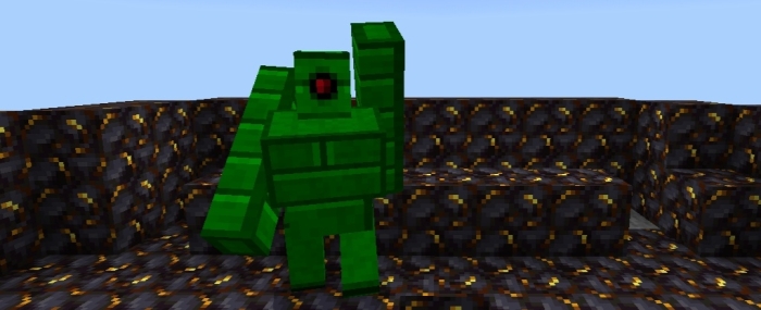 Green block creature on patterned ground.