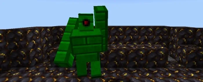 Green block creature on patterned ground.