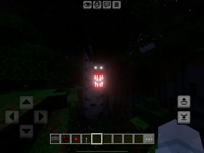 Glowing eyes and mouth on a tree.