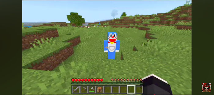 Doraemon character in a grassy field.
