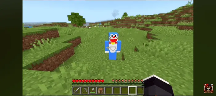 Doraemon character in a grassy field.