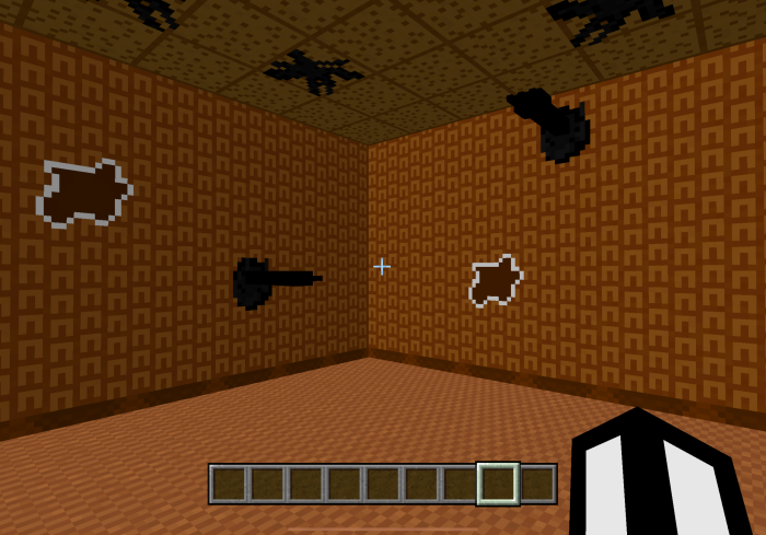 Blocky room with shadowy wall shapes.