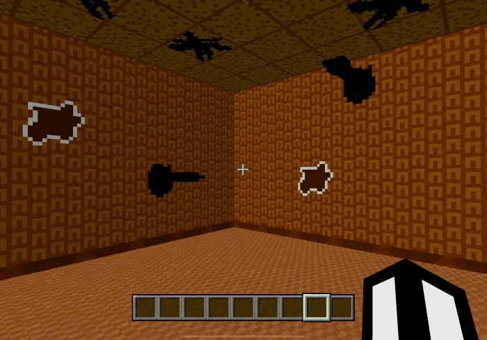 Blocky room with shadowy wall shapes.