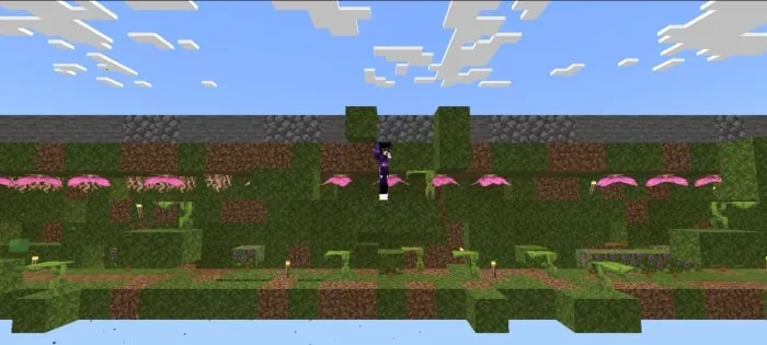 Character jumping in green parkour map.