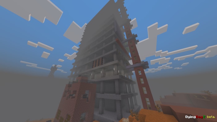 Tall, unfinished building in fog.