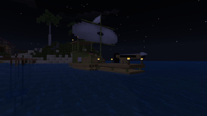 Sailboat on water at night.