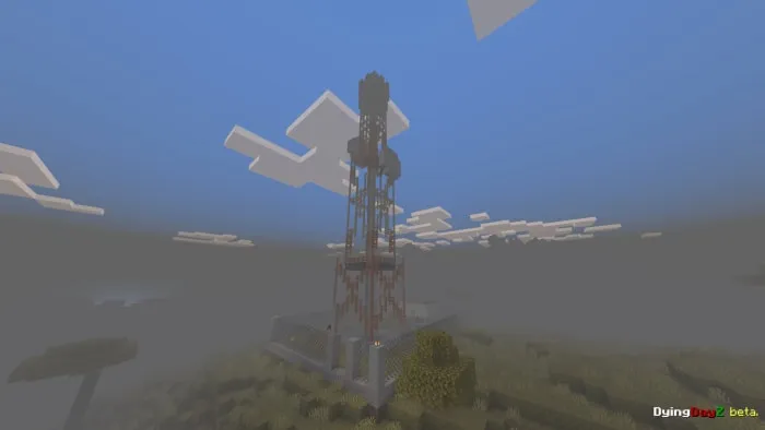 Tall tower structure in a foggy landscape.