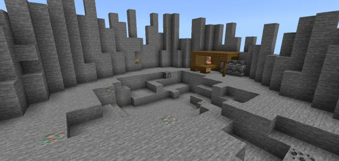 Stone canyon with a wooden cabin.