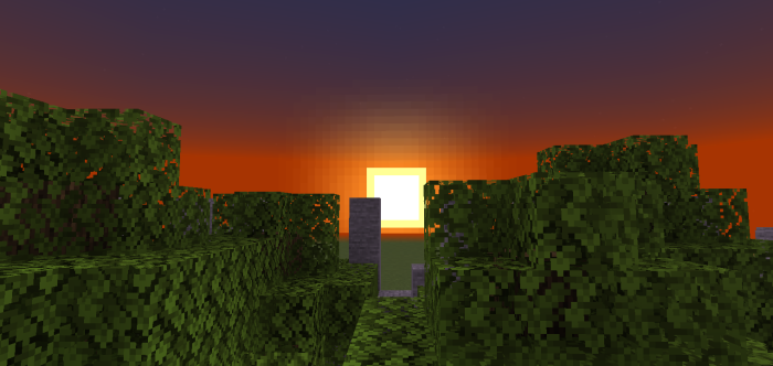Pixelated sunset over blocky green trees.